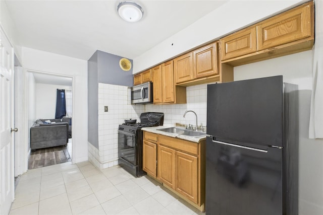 1472 Needham Ave, Bronx, NY 10469 - kitchen featuring black appliances, light countertops, light tile patterned floors, decorative backsplash, and brown cabinetry