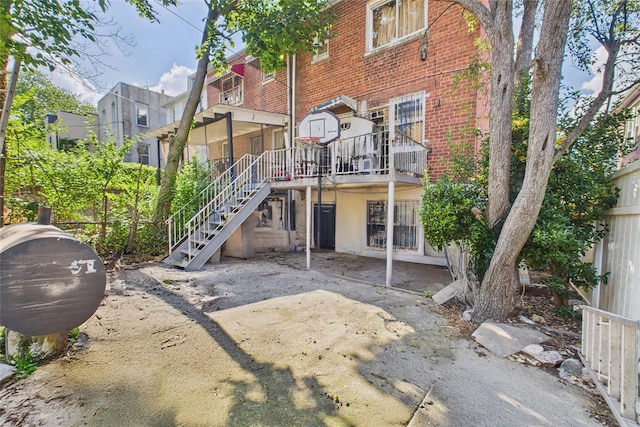 1472 Needham Ave, Bronx, NY 10469 - back of property featuring brick siding and stairway