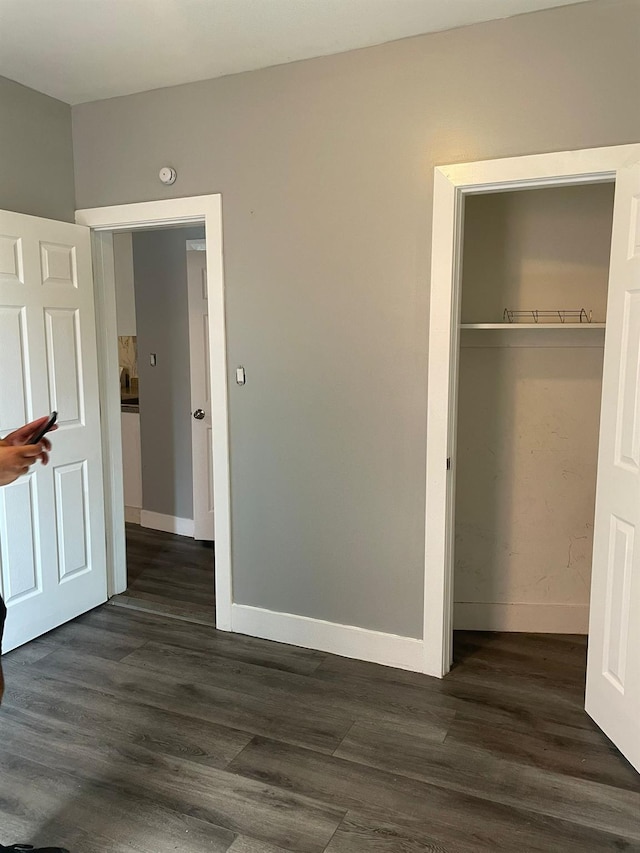 1038 E 224th St, Bronx, NY 10466 - unfurnished bedroom featuring dark wood-style floors