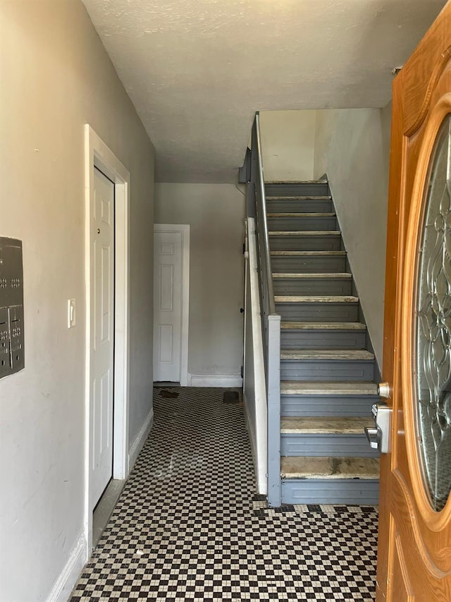 1038 E 224th St, Bronx, NY 10466 - stairs with tile patterned floors and baseboards