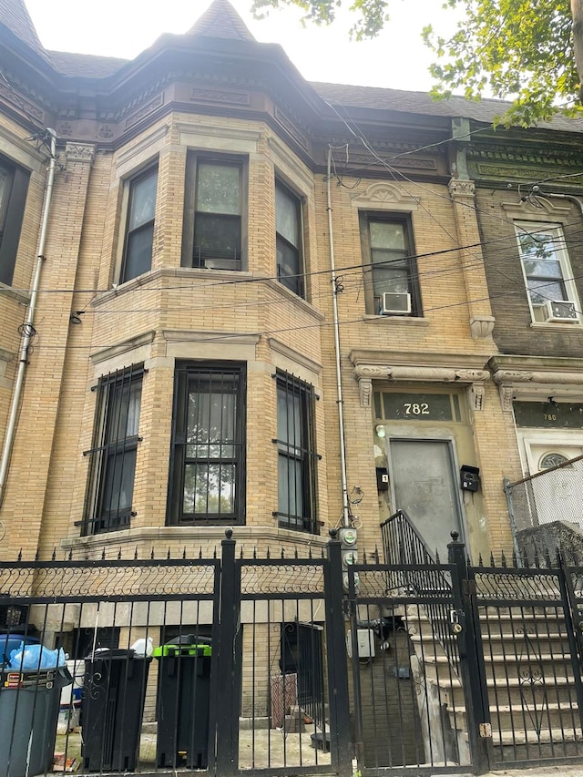 782 Cauldwell Ave, Bronx, NY 10456 - view of building exterior featuring a fenced front yard and cooling unit