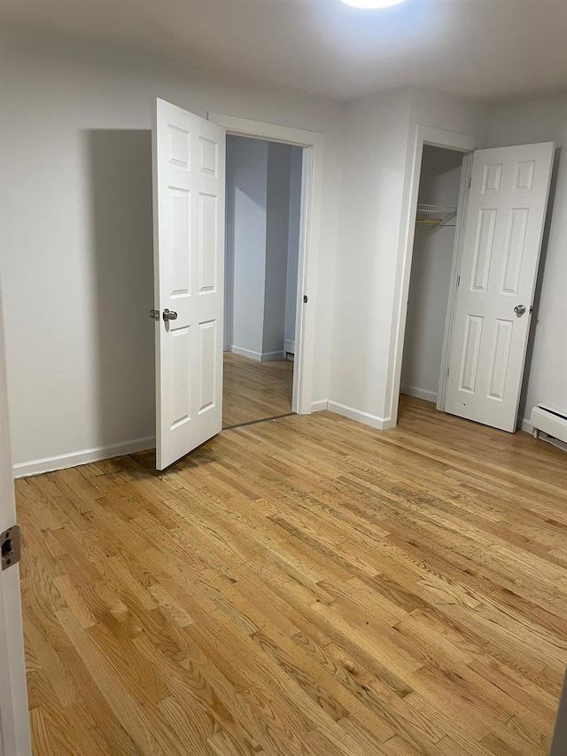 782 Cauldwell Ave, Bronx, NY 10456 - unfurnished bedroom with light wood-type flooring and a closet