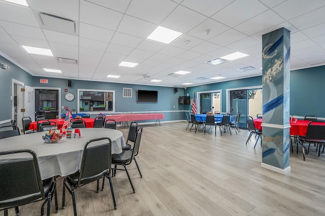 199 Cambridge Dr E, Copiague, NY 11726 - dining area featuring wood finished floors and a paneled ceiling
