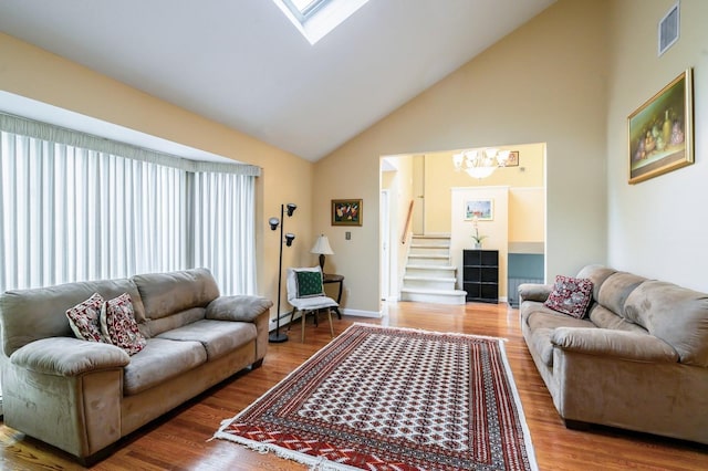 21 Hillvale Rd, Syosset, NY 11791 - living area with a chandelier, high vaulted ceiling, stairs, and wood finished floors