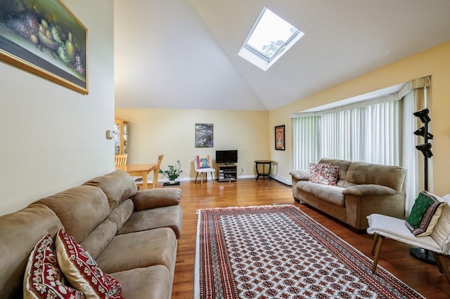 21 Hillvale Rd, Syosset, NY 11791 - living room featuring a skylight, high vaulted ceiling, and wood finished floors