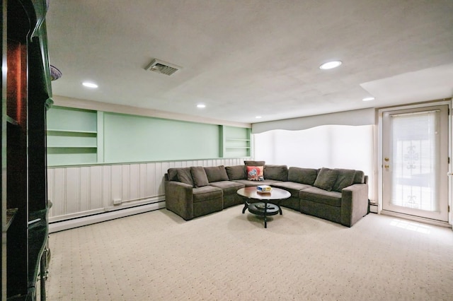21 Hillvale Rd, Syosset, NY 11791 - carpeted living area with baseboard heating, recessed lighting, wainscoting, built in features, and a baseboard radiator