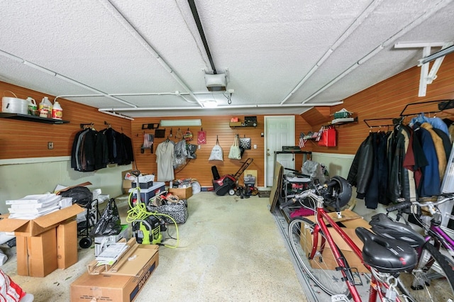 21 Hillvale Rd, Syosset, NY 11791 - garage featuring wooden walls and a garage door opener
