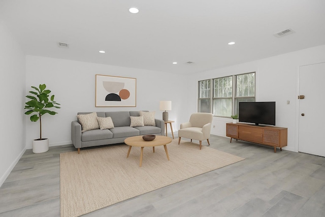975 E 178th St, Bronx, NY 10460 - living room with light wood-style flooring and recessed lighting