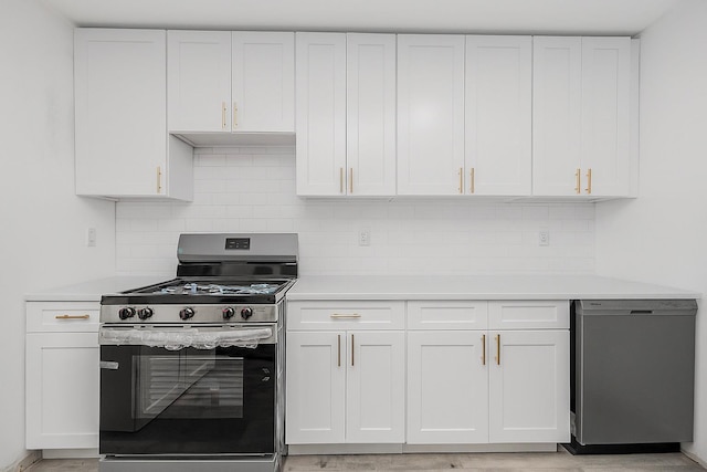 975 E 178th St, Bronx, NY 10460 - kitchen featuring appliances with stainless steel finishes, light countertops, and white cabinets