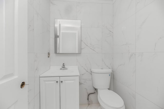 975 E 178th St, Bronx, NY 10460 - half bath featuring vanity and tile walls