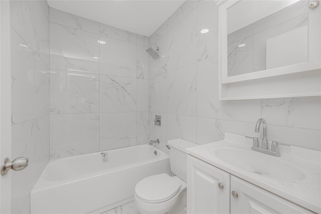 975 E 178th St, Bronx, NY 10460 - bathroom featuring washtub / shower combination, vanity, marble finish floors, and tile walls