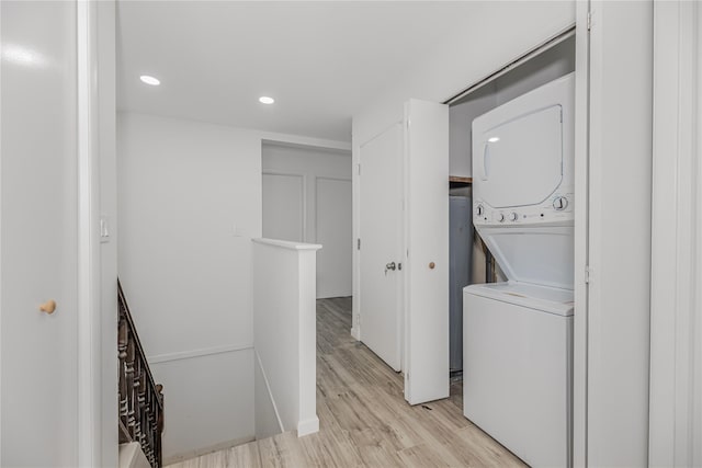 975 E 178th St, Bronx, NY 10460 - laundry room with stacked washer / dryer, light wood-style floors, and recessed lighting