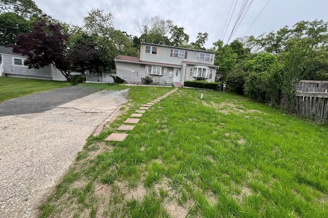 232 Sugarwood Ln, Central Islip, NY 11722 - view of front of house featuring asphalt driveway