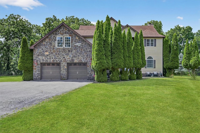 70 Hosner Mountain Rd, Hopewell Junction, NY 12533 - view of front of home featuring a front lawn, driveway, an attached garage, and a chimney