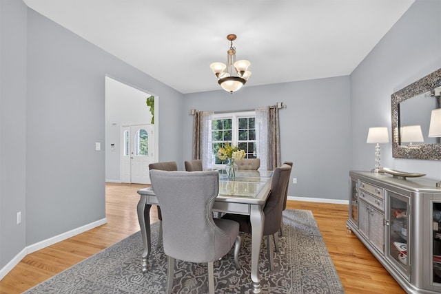 70 Hosner Mountain Rd, Hopewell Junction, NY 12533 - dining area with a chandelier and light wood-style floors