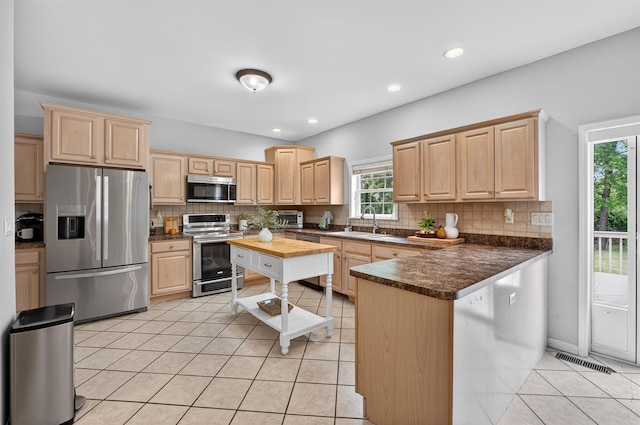 70 Hosner Mountain Rd, Hopewell Junction, NY 12533 - kitchen with light brown cabinets, stainless steel appliances, and recessed lighting