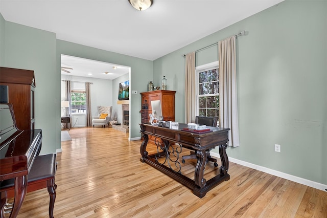 70 Hosner Mountain Rd, Hopewell Junction, NY 12533 - office area featuring light wood-style floors and a fireplace with raised hearth