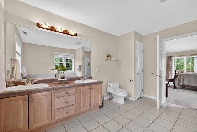 70 Hosner Mountain Rd, Hopewell Junction, NY 12533 - full bath with tile patterned flooring, plenty of natural light, double vanity, and connected bathroom