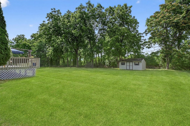 70 Hosner Mountain Rd, Hopewell Junction, NY 12533 - view of grassy yard with a wooden deck and a storage shed