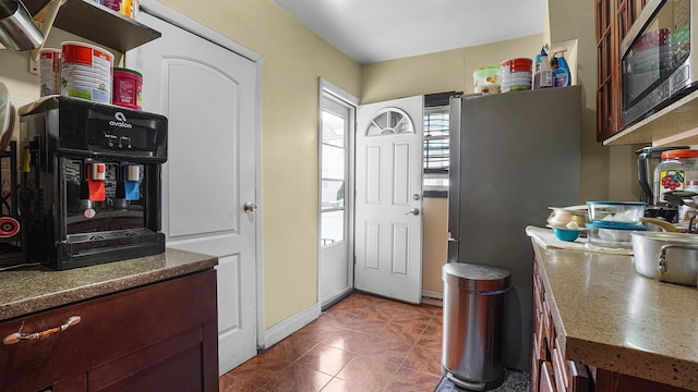 164-02 107th Ave, Jamaica, NY 11433 - kitchen featuring stainless steel appliances and dark tile patterned floors