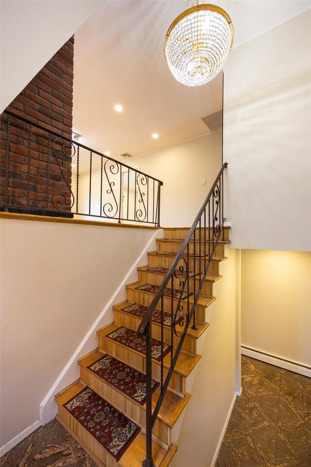 15 Linden St, Great Neck, NY 11021 - stairs featuring a chandelier, a baseboard radiator, and recessed lighting