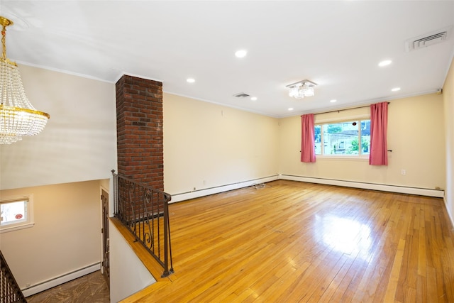 15 Linden St, Great Neck, NY 11021 - unfurnished room featuring a baseboard heating unit, a chandelier, crown molding, wood-type flooring, and recessed lighting