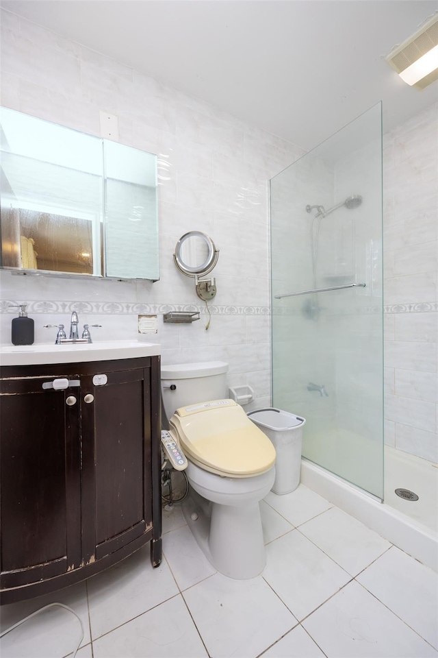 15 Linden St, Great Neck, NY 11021 - bathroom featuring tile patterned floors, tiled shower, and vanity