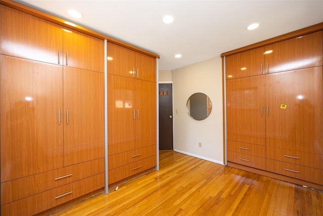 15 Linden St, Great Neck, NY 11021 - unfurnished bedroom featuring light wood-type flooring and recessed lighting