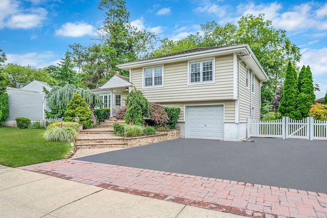 76 Keswick Ln, Plainview, NY 11803 - split level home with asphalt driveway and an attached garage