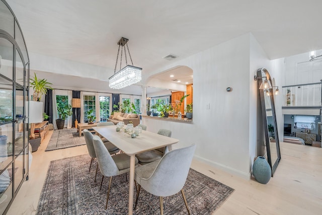 76 Keswick Ln, Plainview, NY 11803 - dining space featuring wood finished floors and arched walkways