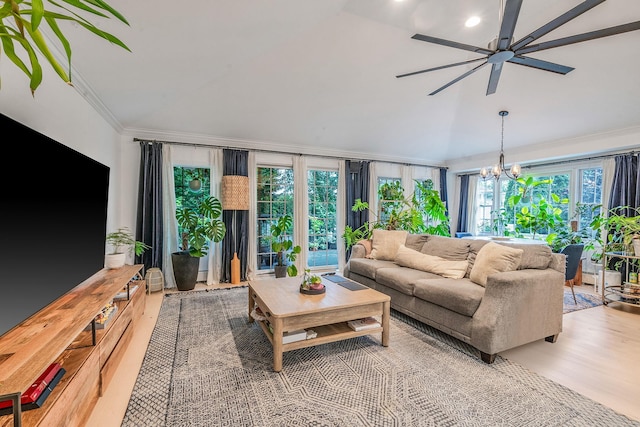 76 Keswick Ln, Plainview, NY 11803 - living area with ceiling fan, ornamental molding, a chandelier, lofted ceiling, and wood finished floors