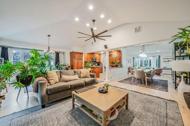 76 Keswick Ln, Plainview, NY 11803 - living area featuring a chandelier, lofted ceiling, recessed lighting, ornate columns, and light wood-type flooring
