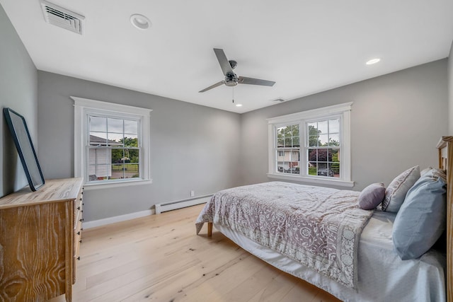 76 Keswick Ln, Plainview, NY 11803 - bedroom featuring a baseboard radiator, wood finished floors, recessed lighting, and a ceiling fan