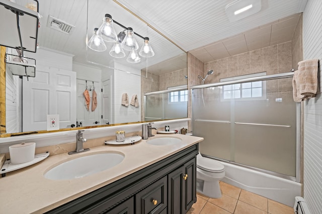 76 Keswick Ln, Plainview, NY 11803 - full bath with tile patterned flooring, bath / shower combo with glass door, double vanity, and baseboard heating