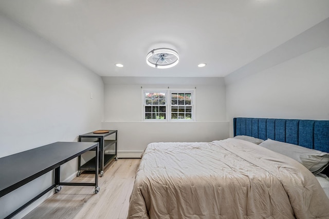 76 Keswick Ln, Plainview, NY 11803 - bedroom with light wood-style floors, a baseboard heating unit, and recessed lighting