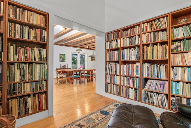 3778 State Route 82, Ancramdale, NY 12503 - living area with bookshelves, wood finished floors, and beam ceiling