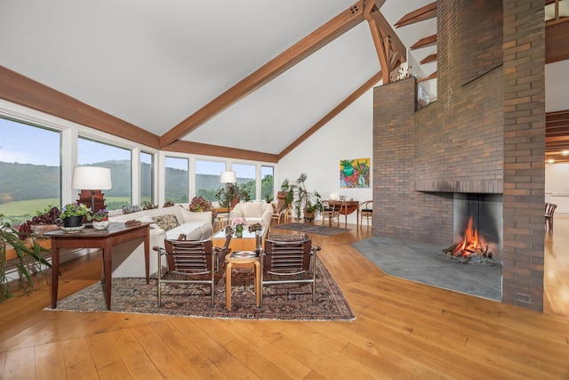 3778 State Route 82, Ancramdale, NY 12503 - living room with high vaulted ceiling, beam ceiling, hardwood / wood-style floors, and a brick fireplace