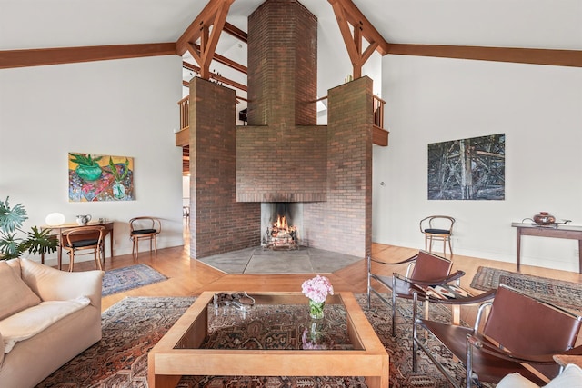 3778 State Route 82, Ancramdale, NY 12503 - living room featuring high vaulted ceiling, beam ceiling, a brick fireplace, wood finished floors, and decorative columns