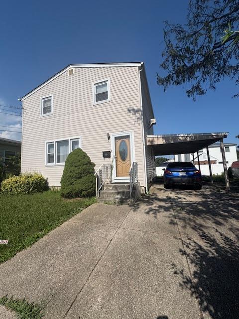 220 Elzy Ave, Elmont, NY 11003 - traditional-style house featuring concrete driveway