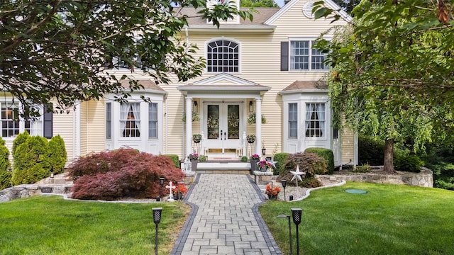 53 Quail Ln, Brewster, NY 10509 - view of front of home with a front lawn, french doors, and roof with shingles