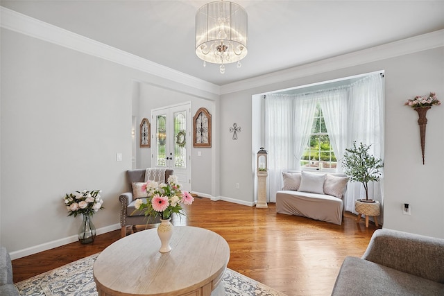 53 Quail Ln, Brewster, NY 10509 - living room featuring ornamental molding, a chandelier, and wood finished floors
