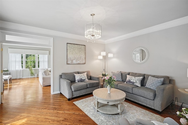 53 Quail Ln, Brewster, NY 10509 - living room featuring a chandelier, ornamental molding, and light wood-style floors