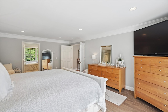 53 Quail Ln, Brewster, NY 10509 - bedroom featuring ornamental molding, wood finished floors, arched walkways, and recessed lighting