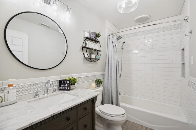 53 Quail Ln, Brewster, NY 10509 - full bath featuring tile walls, vanity, shower / tub combo, wainscoting, and wood finished floors