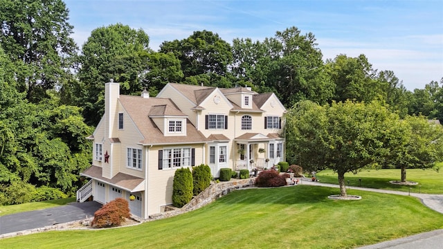 53 Quail Ln, Brewster, NY 10509 - shingle-style home with an attached garage, a front yard, driveway, and view of scattered trees