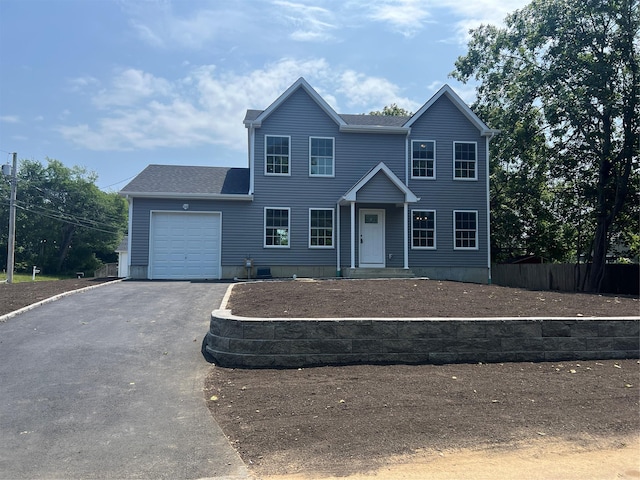 96 Baybright Dr, Shirley, NY 11967 - view of front of home with an attached garage, driveway, and roof with shingles