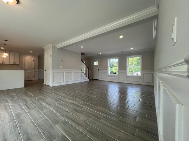 96 Baybright Dr, Shirley, NY 11967 - unfurnished living room with a decorative wall, ornamental molding, stairs, recessed lighting, and wainscoting