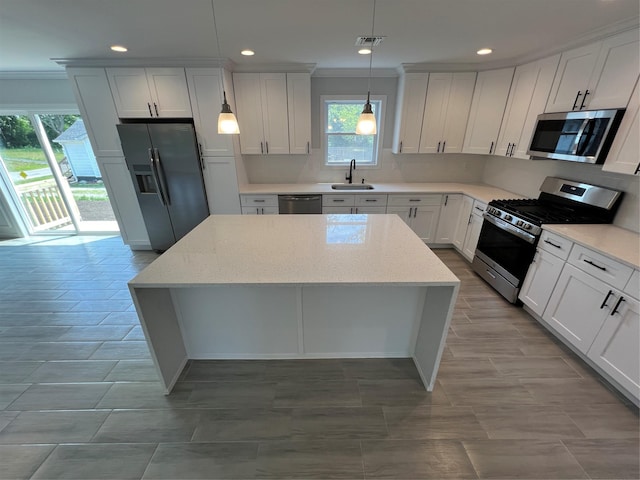 96 Baybright Dr, Shirley, NY 11967 - kitchen featuring stainless steel appliances, a center island, decorative backsplash, recessed lighting, and decorative light fixtures