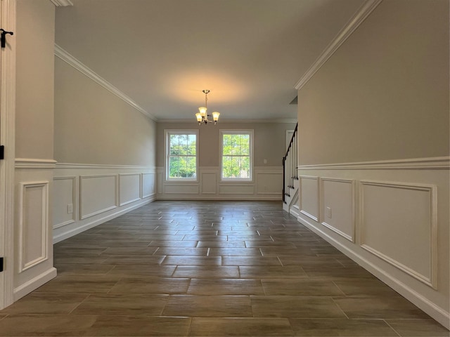 96 Baybright Dr, Shirley, NY 11967 - unfurnished dining area featuring a chandelier, a decorative wall, ornamental molding, stairs, and dark wood-type flooring