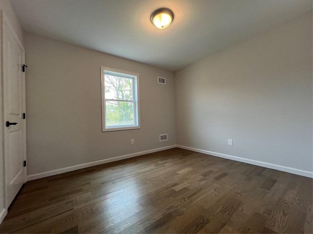 96 Baybright Dr, Shirley, NY 11967 - spare room with dark wood-style flooring and baseboards